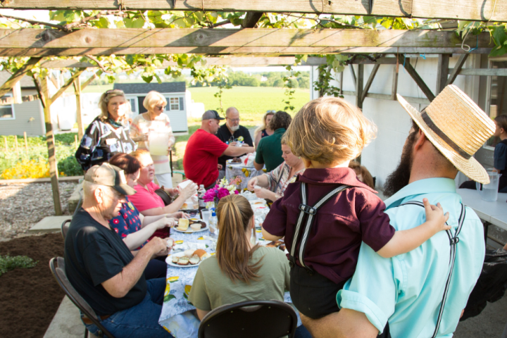 a group of people sitting on a bench
